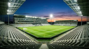 Taktiske spillstrategier for tipping på VM 2026 med fotballstadion i bakgrunnen